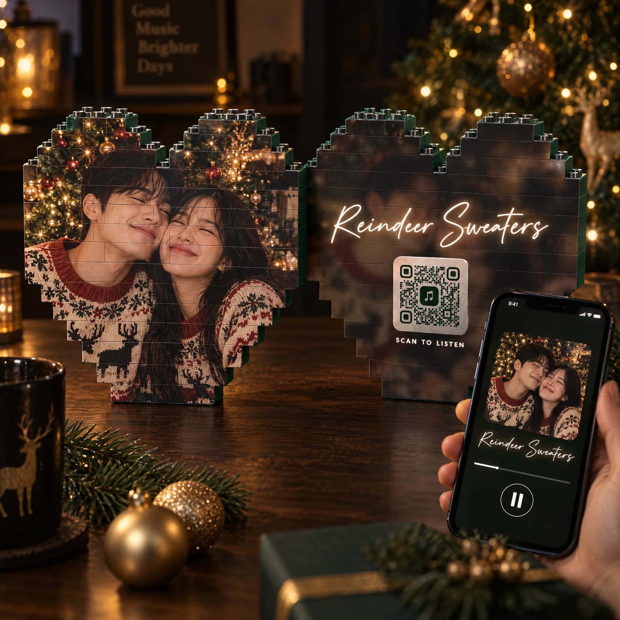 Front and back of the brick heart on a table by the Christmas tree, a phone scanning the back and playing the song Reindeer Sweaters
